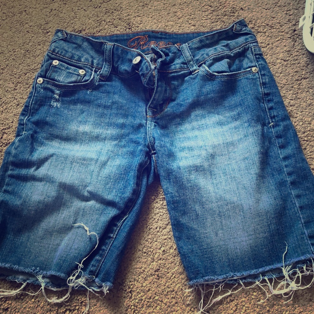 Thigh length jean shorts.